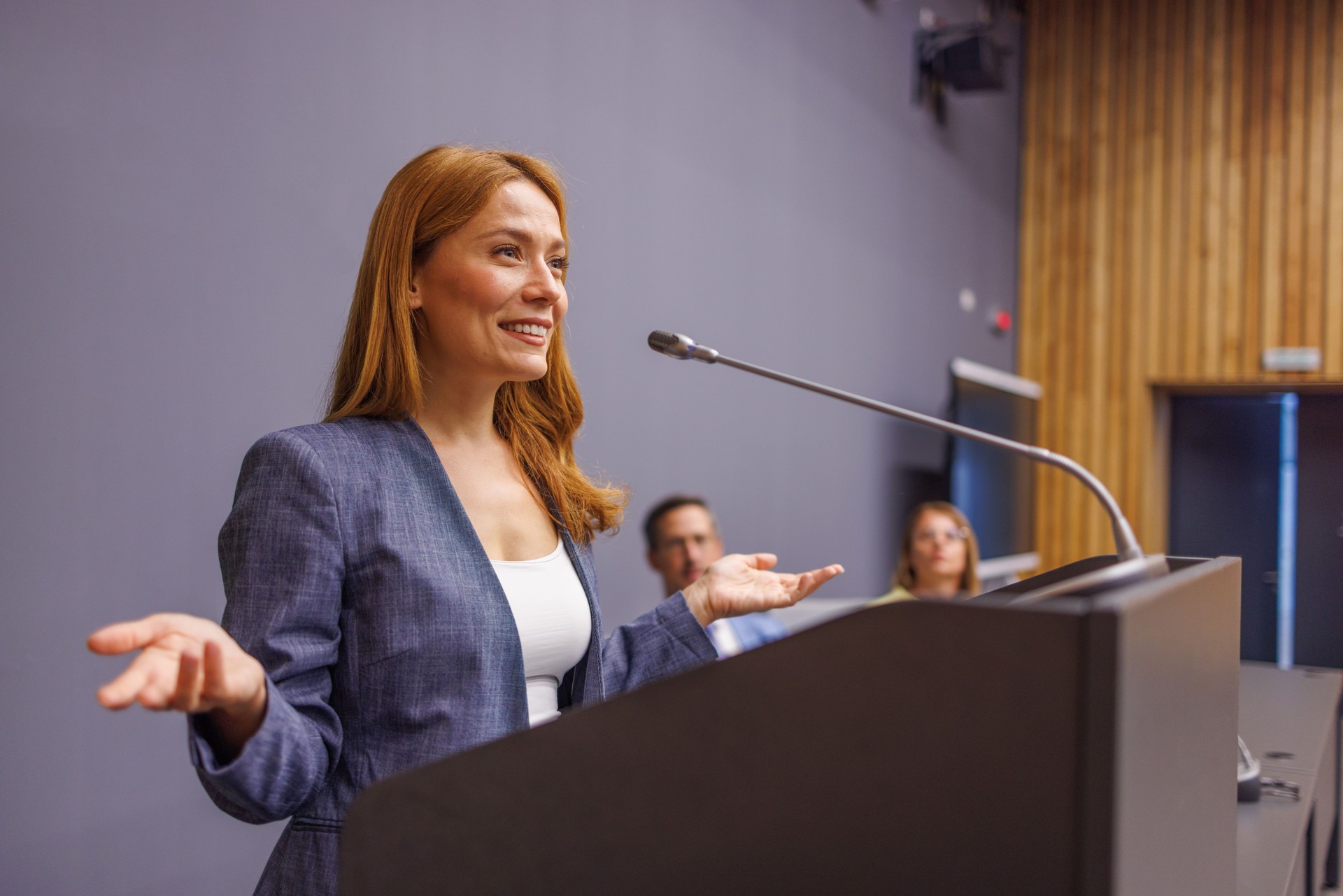 Motivational speaker inspiring audience with her presentation