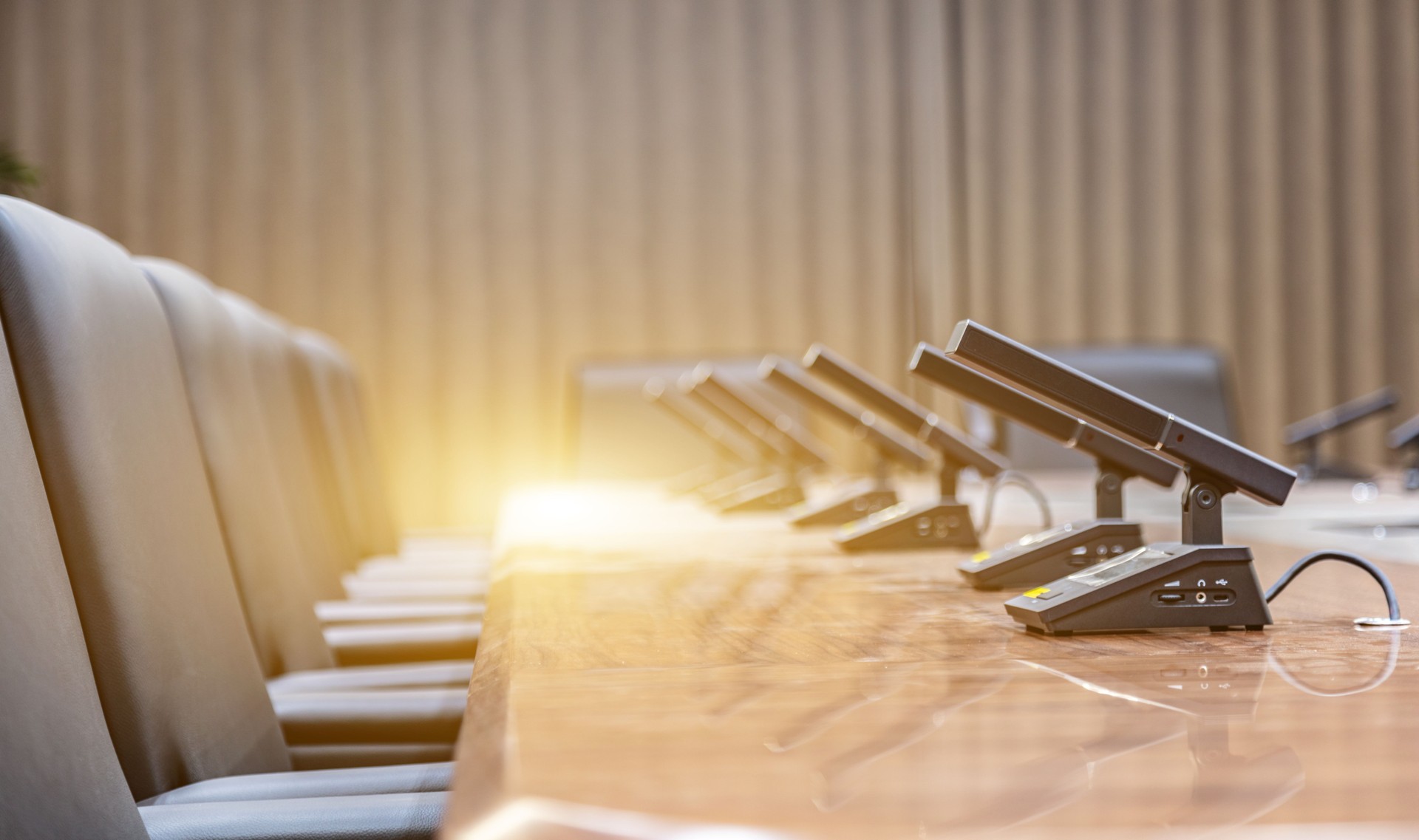 Microphone on table in empty conference room